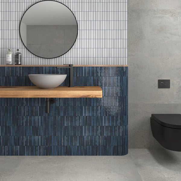 Contemporary bathroom interior with blue tile feature wall and wall-hung vanity