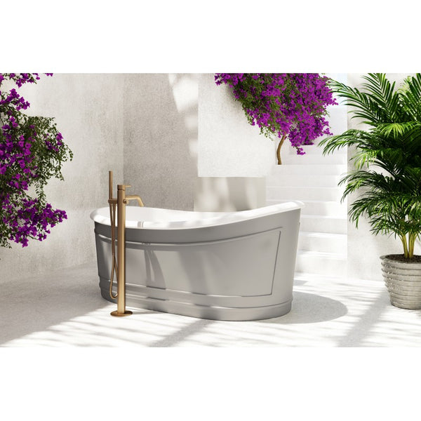 A freestanding bathtub with a matt grey finish, placed in a bathroom setting with plants and a floral wall in the background.
