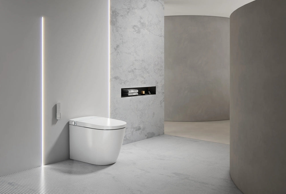 Modern toilet in a minimalistic bathroom with gray walls and floor.