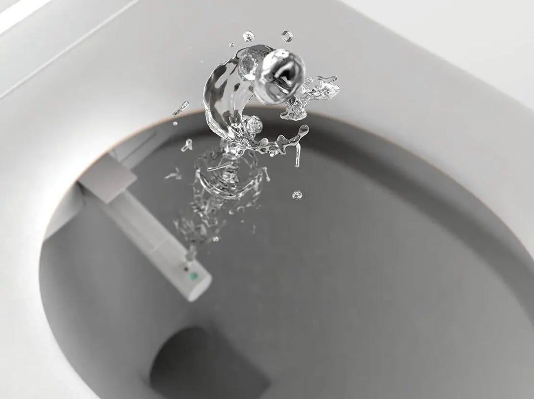 Close-up of water splashing into a sink with a blurred background