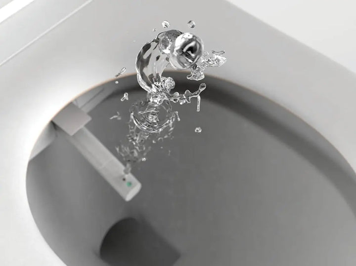 Close-up of water splashing into a sink with a blurred background