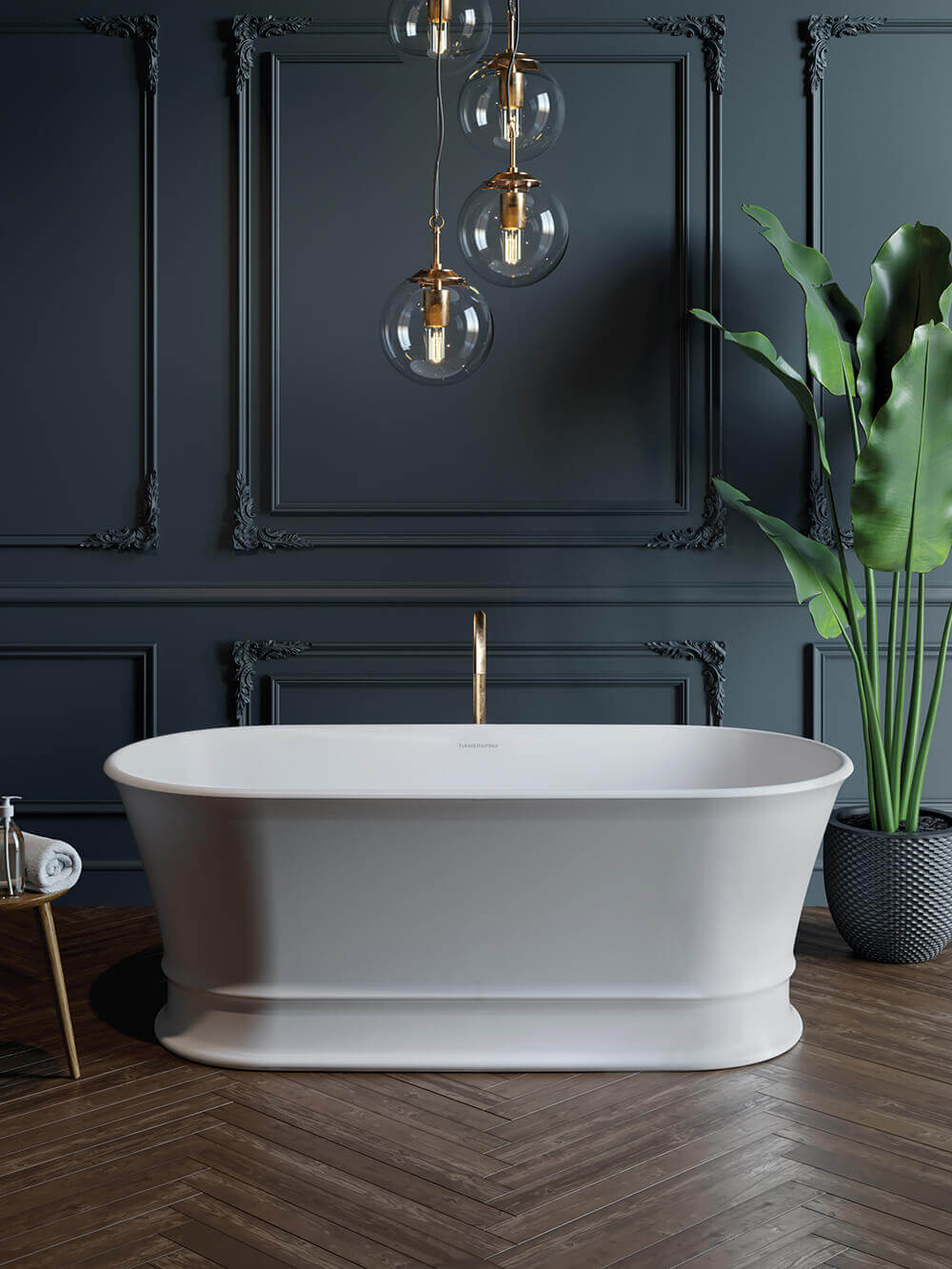 White freestanding bathtub in a stylish bathroom with dark walls, pendant lights, and a plant.